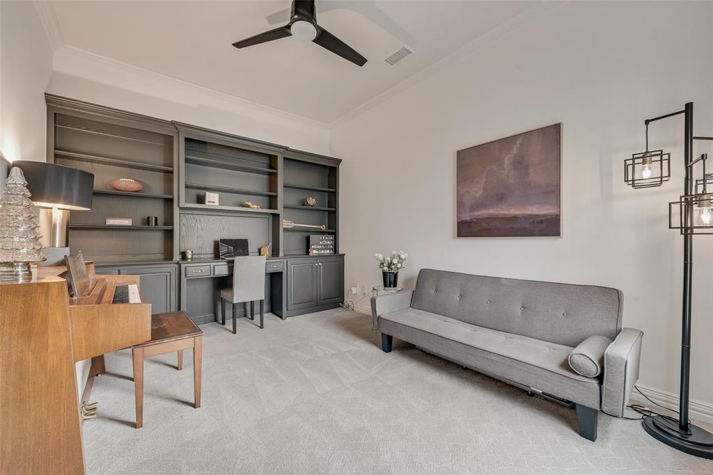 15 Falcons View Pass Heath, TX 75032 - Photo 18 of 38 a living room with furniture and a book shelf