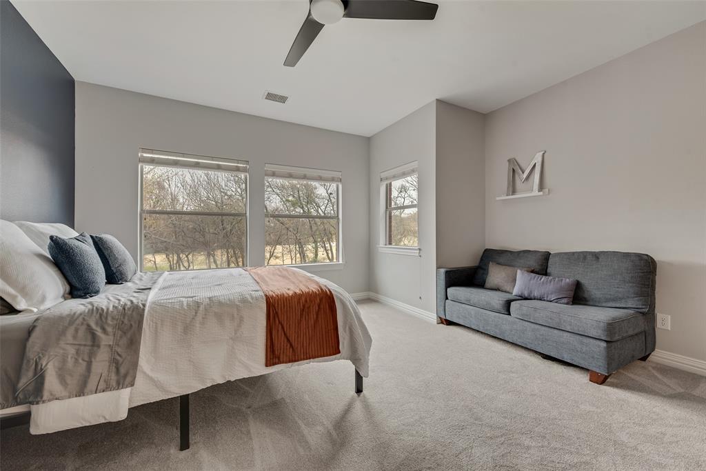 15 Falcons View Pass Heath, TX 75032 - Photo 24 of 38 a living room with a couch and a window