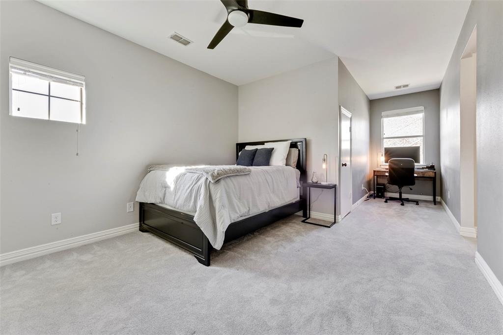 15 Falcons View Pass Heath, TX 75032 - Photo 26 of 38 a bed room with a bed and a chair