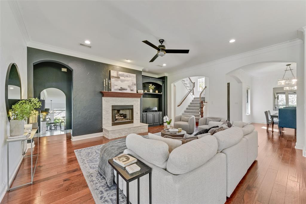 15 Falcons View Pass Heath, TX 75032 - Photo 5 of 38 a living room with fireplace furniture and a wooden floor