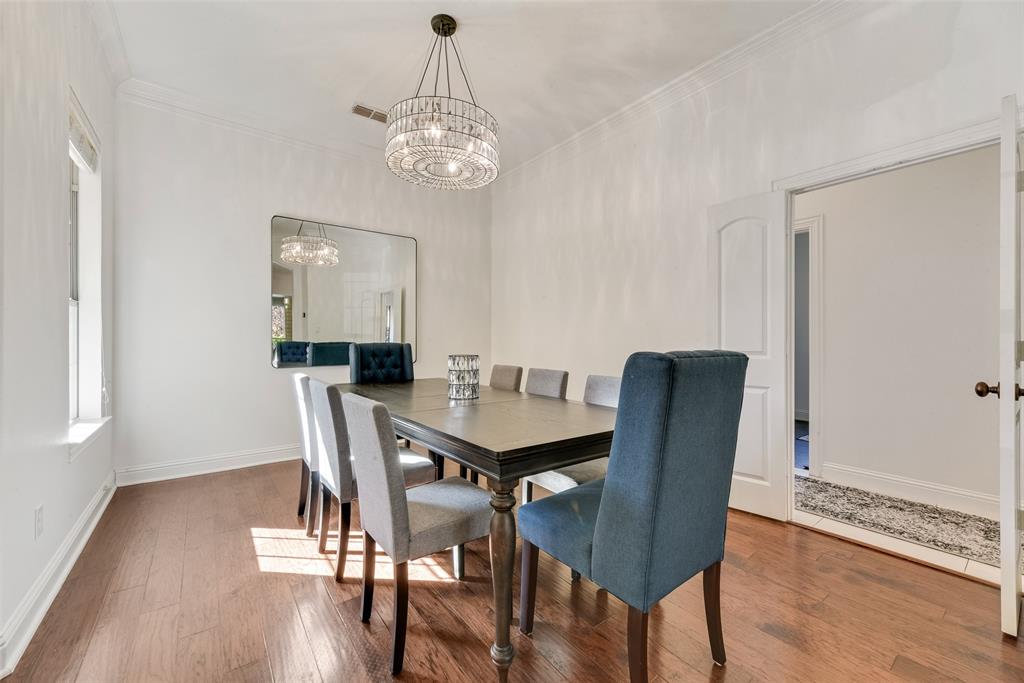 15 Falcons View Pass Heath, TX 75032 - Photo 6 of 38 a view of a dining room with furniture wooden floor and chandelier