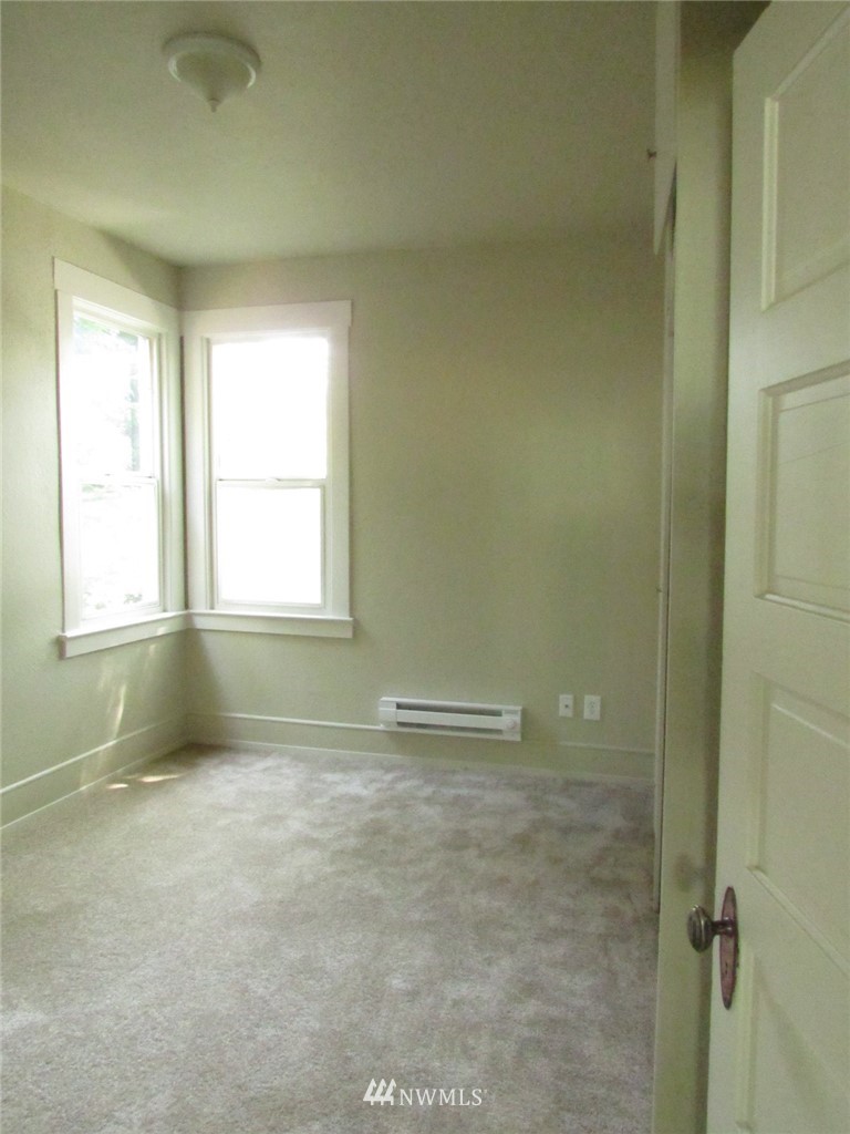 100 Northwest 3rd Place Renton, WA 98057 - Photo 11 of 18 a view of an empty room with a window
