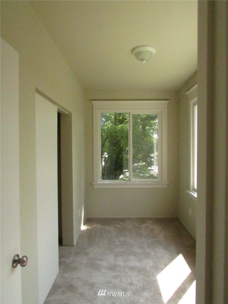 100 Northwest 3rd Place Renton, WA 98057 - Photo 3 of 18 a view of an empty room with a window