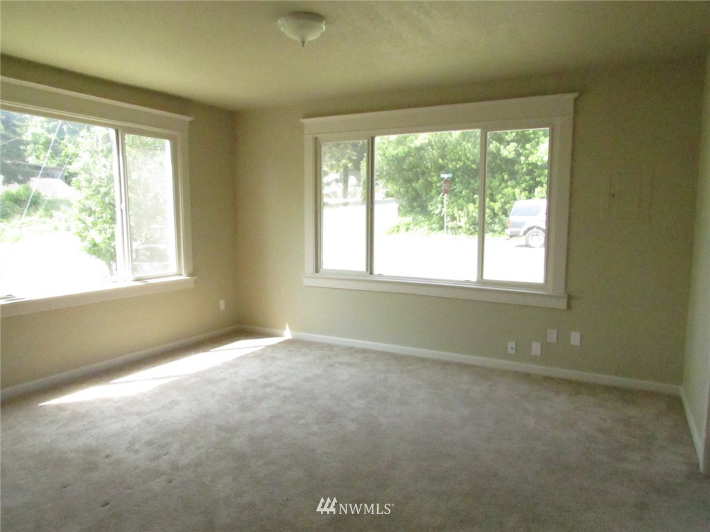 100 Northwest 3rd Place Renton, WA 98057 - Photo 5 of 18 an empty room with a window
