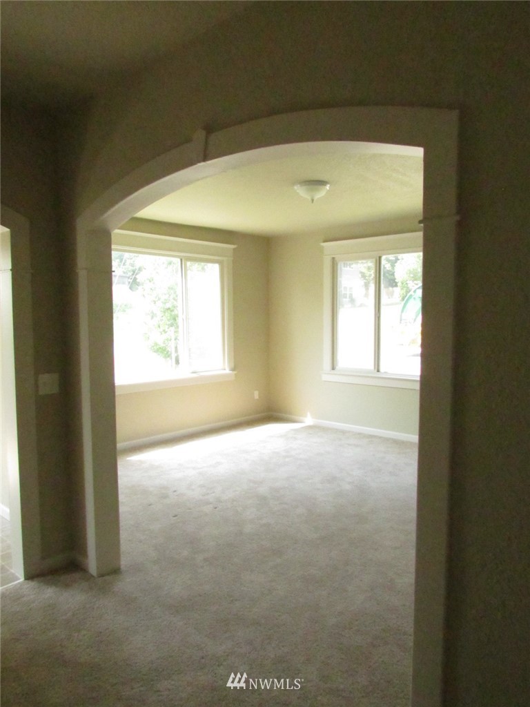100 Northwest 3rd Place Renton, WA 98057 - Photo 6 of 18 a view of empty room with window