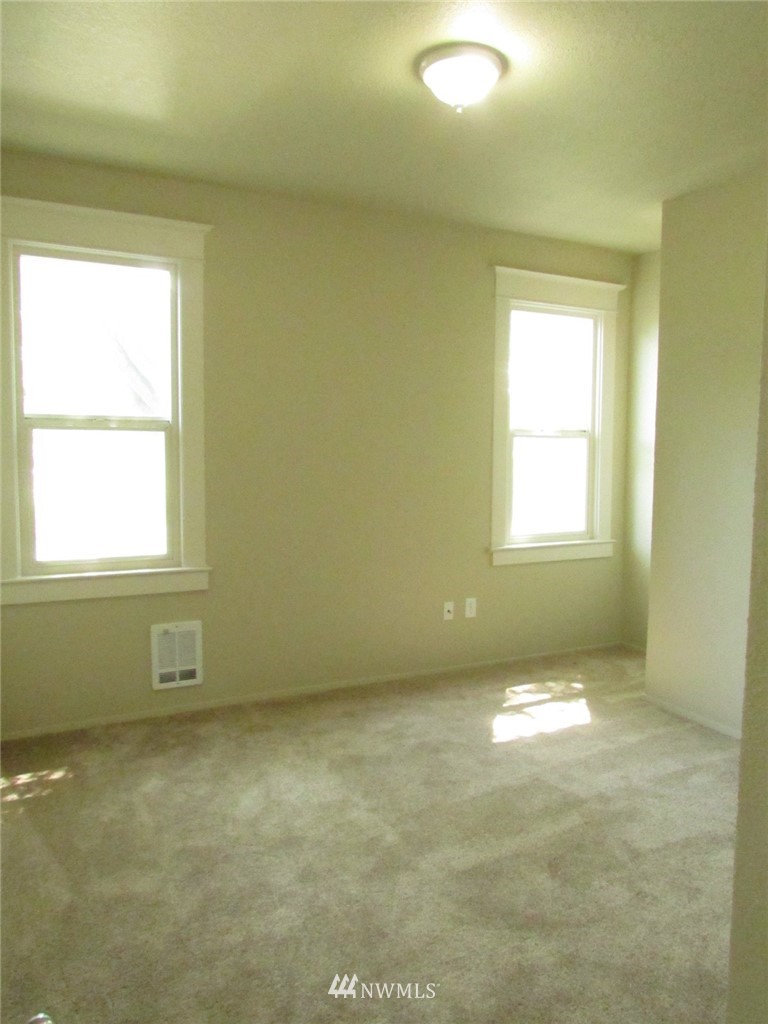 100 Northwest 3rd Place Renton, WA 98057 - Photo 9 of 18 a view of an empty room with a window