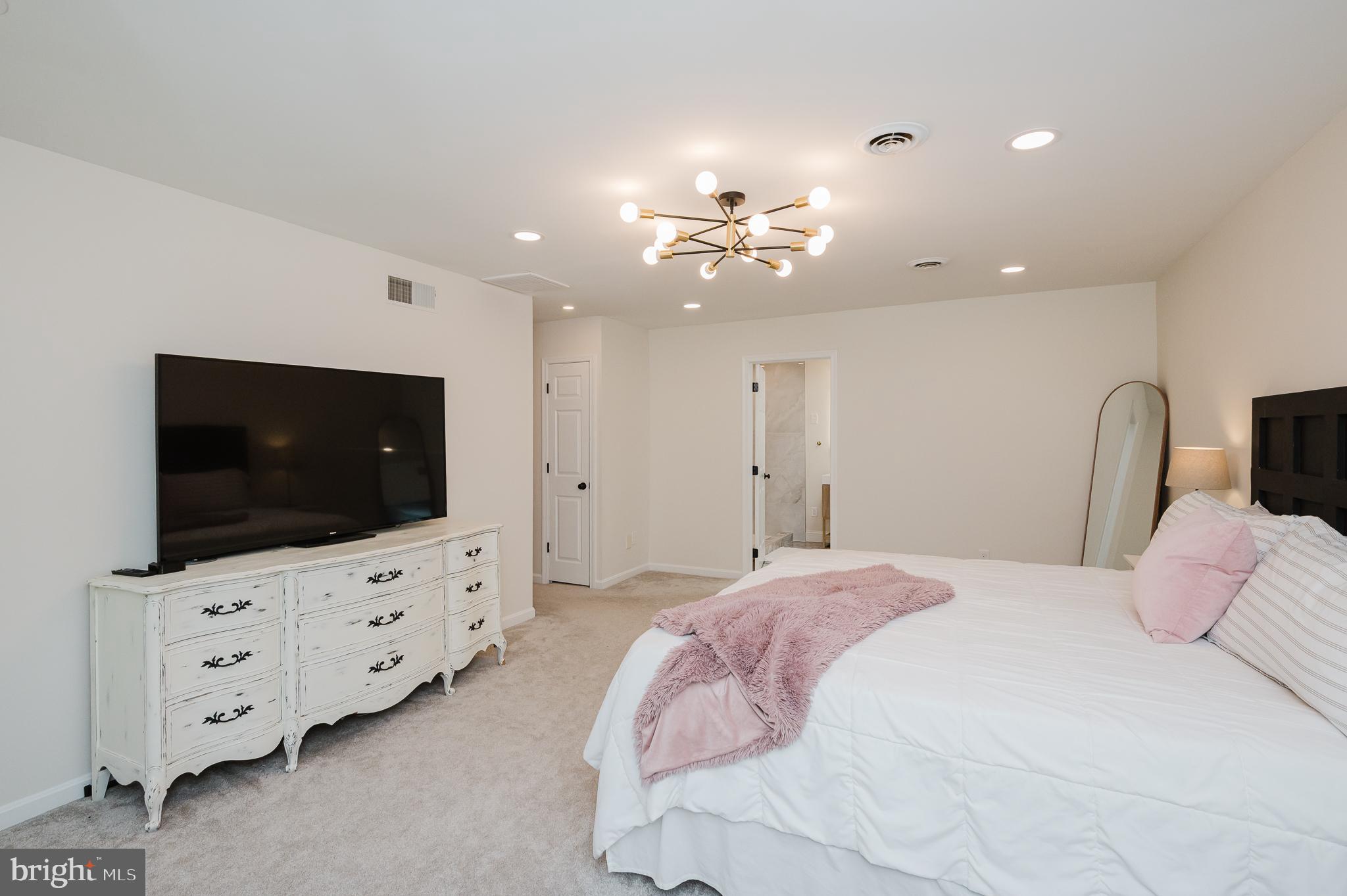 2056 Chapel Road Havre de Grace, MD 21078 - Photo 49 of 120 a bedroom with a bed and a flat screen tv