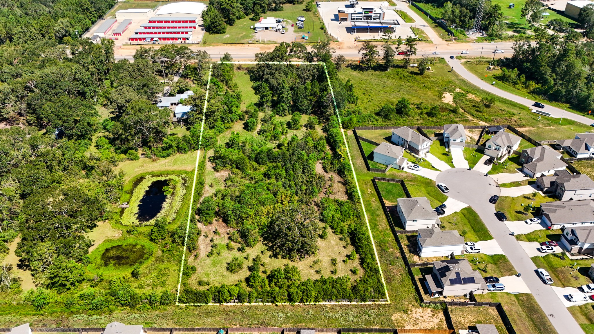 17652 Highway 105 East Conroe, TX 77306 - Photo 1 of 14 a view of a yard with plants