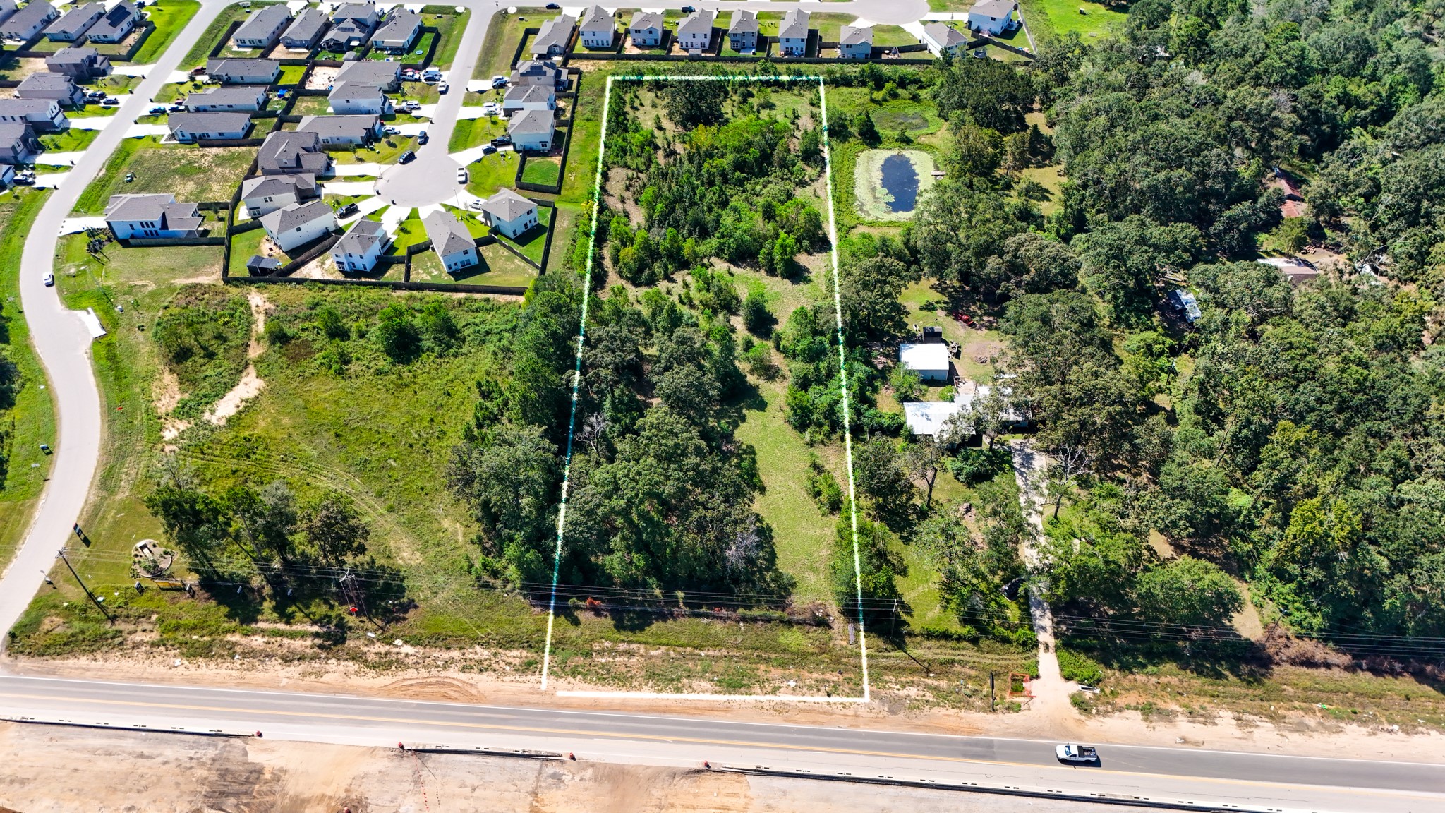 17652 Highway 105 East Conroe, TX 77306 - Photo 14 of 14 a view of a yard in front of a house with a tree