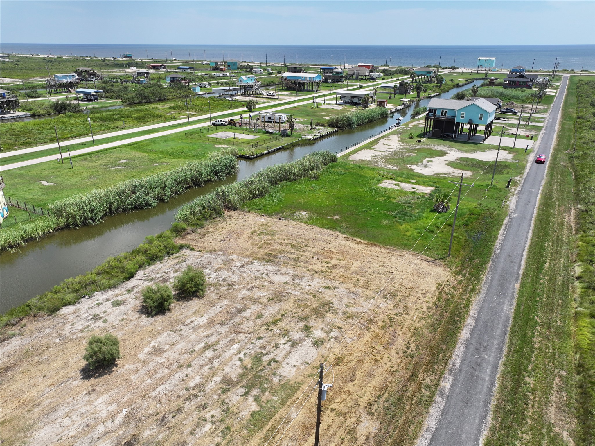 0 Pennington Port Bolivar, TX 77650 - Photo 2 of 7 a view of a lake with a yard