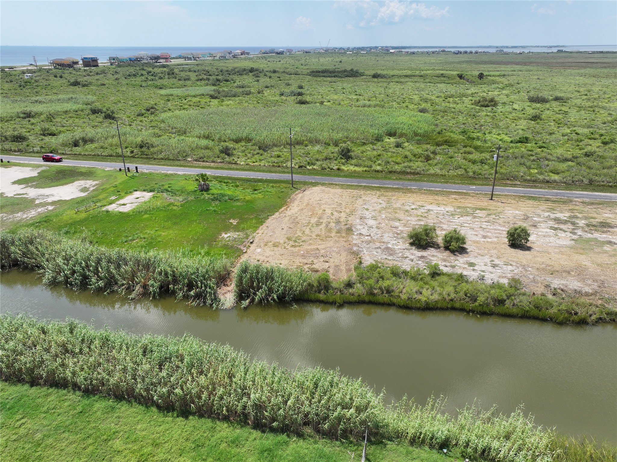 0 Pennington Port Bolivar, TX 77650 - Photo 4 of 7 a view of a lake with a city