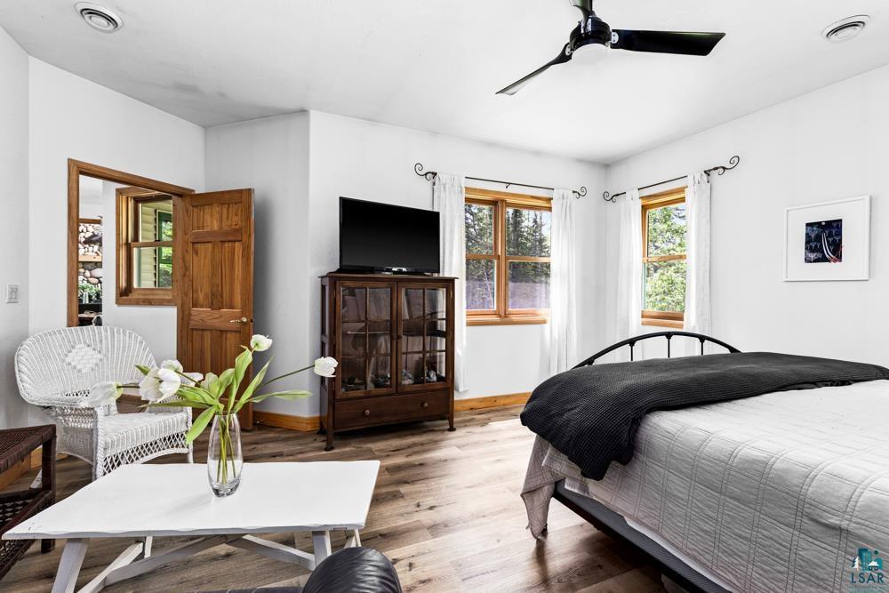 4471 South Rockmont Road South Range, WI 54874 - Photo 23 of 48 Bedroom with wood-type flooring and ceiling fan