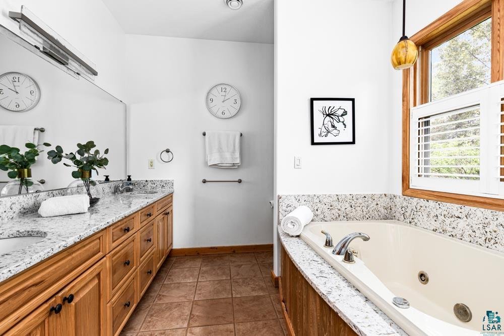4471 South Rockmont Road South Range, WI 54874 - Photo 24 of 48 Bathroom with double vanity and tile flooring