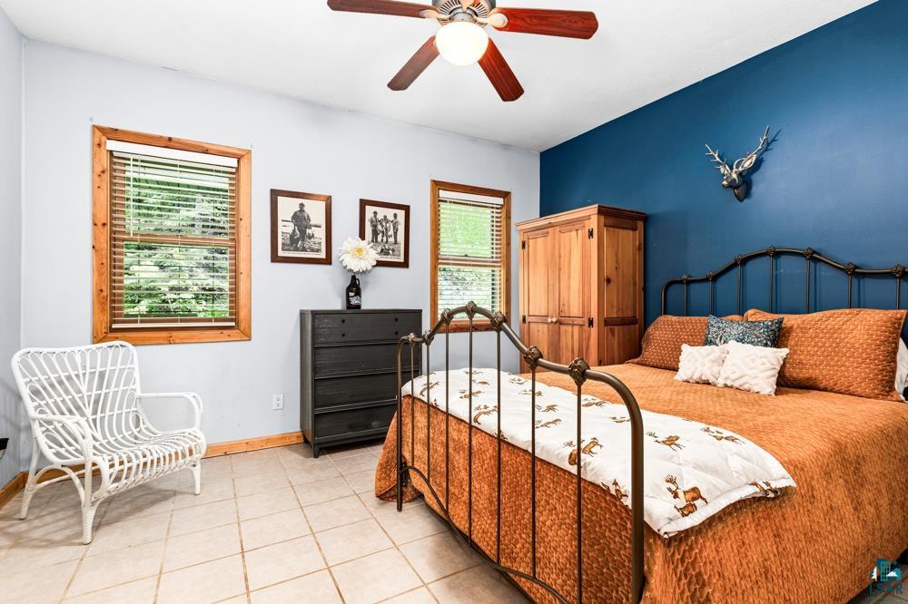 4471 South Rockmont Road South Range, WI 54874 - Photo 27 of 48 Tiled bedroom featuring ceiling fan