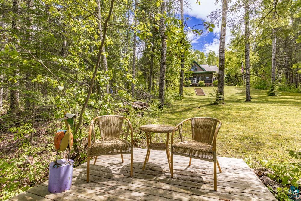 4471 South Rockmont Road South Range, WI 54874 - Photo 42 of 48 Wooden deck with a lawn