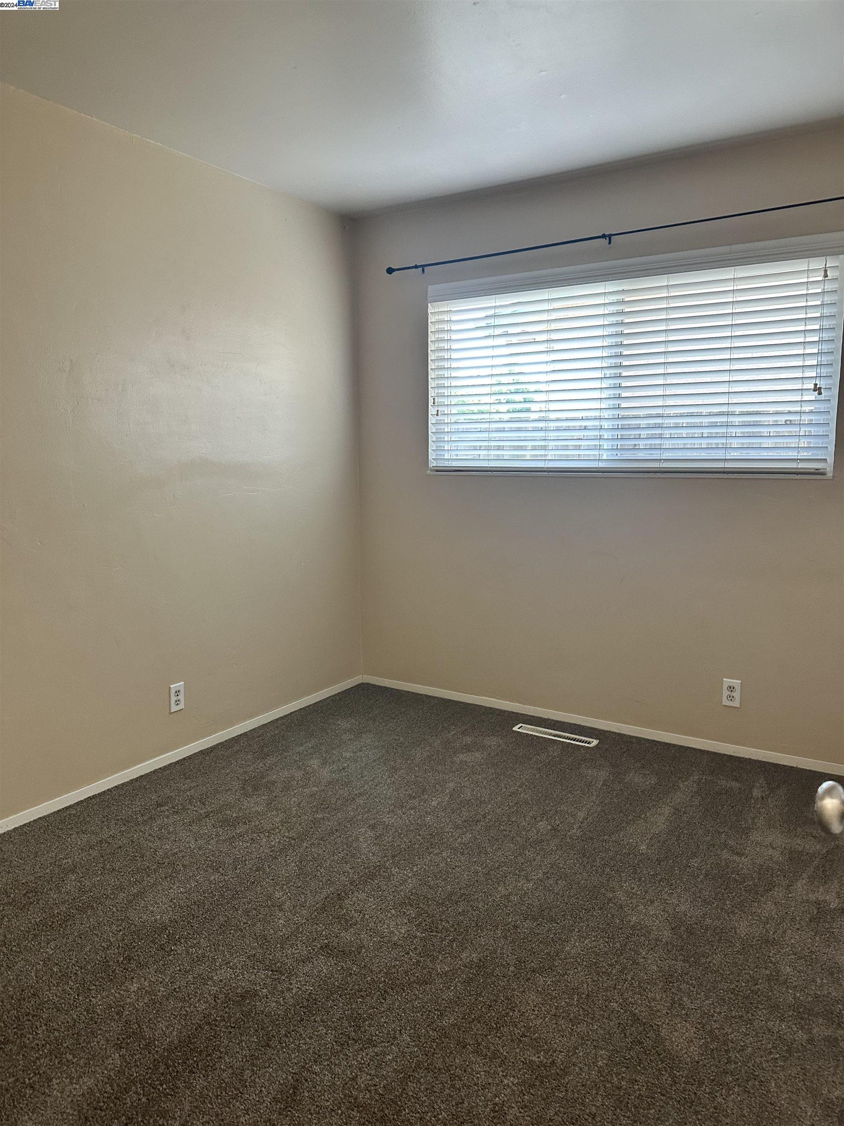 Carlton Square Livermore, CA 94550 - Photo 14 of 25 an empty room with a window