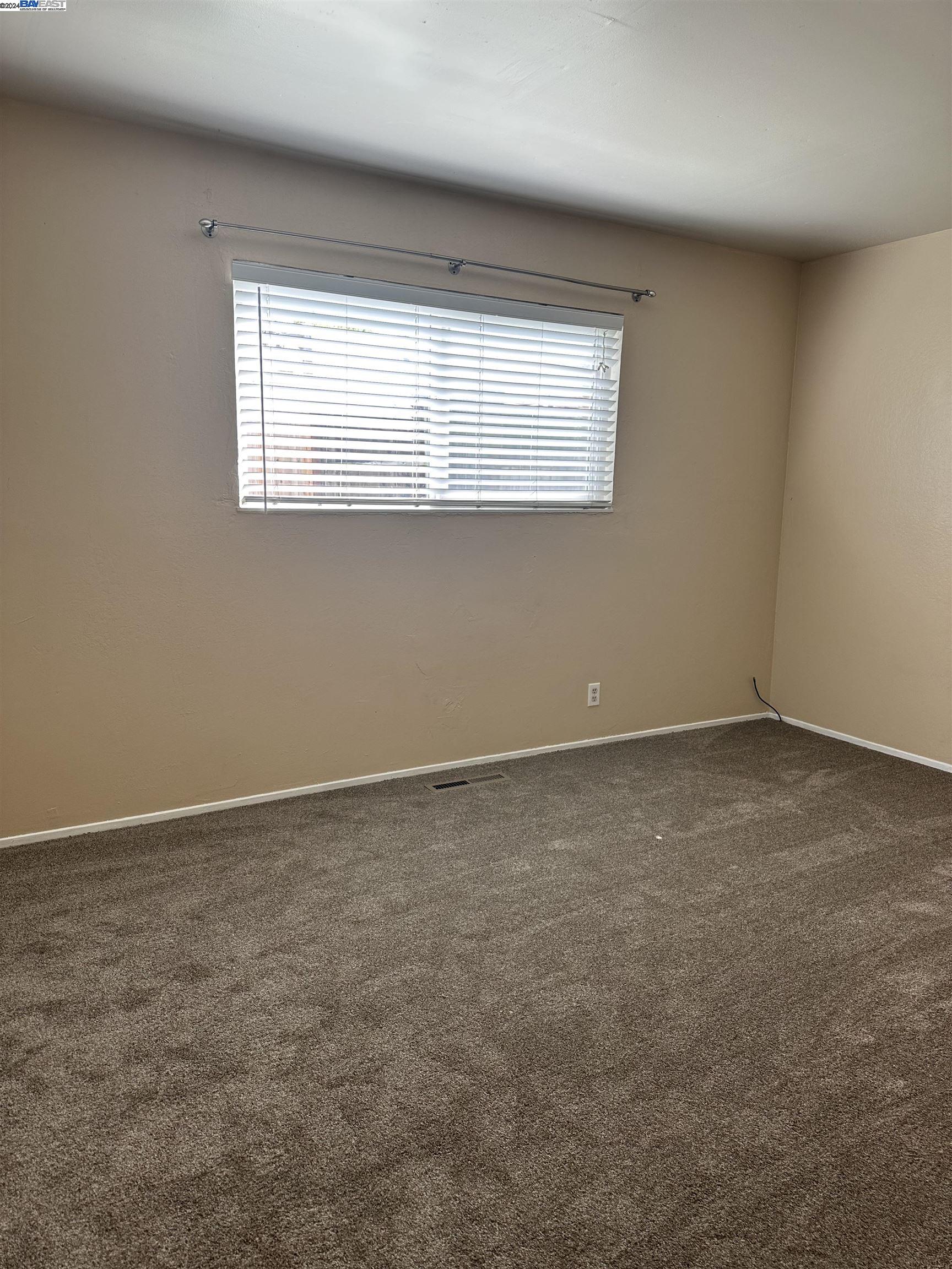 Carlton Square Livermore, CA 94550 - Photo 15 of 25 an empty room with a window