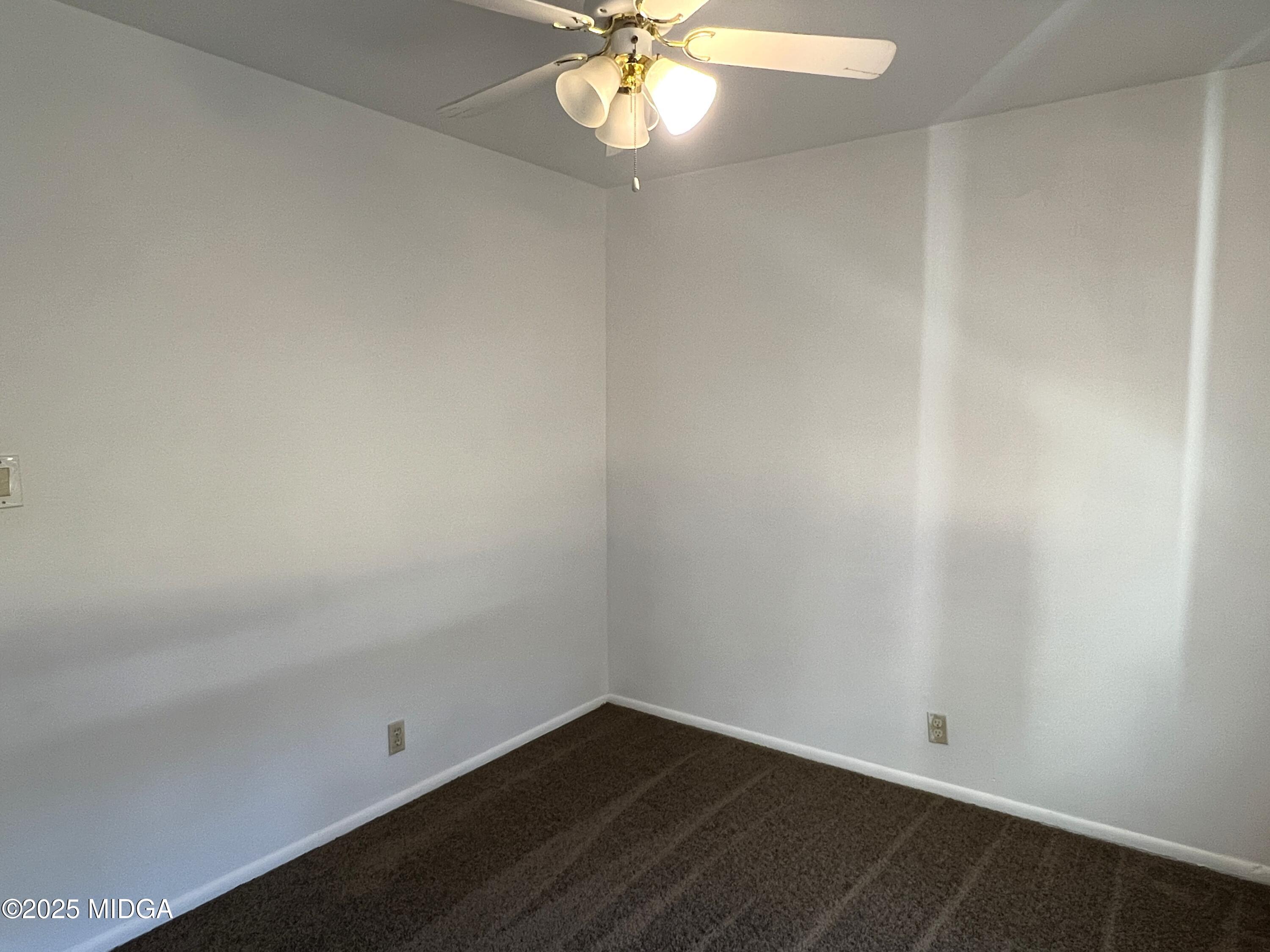 3347 Thunderbird Road Macon, GA 31217 - Photo 14 of 27 an empty room with a window and a fan