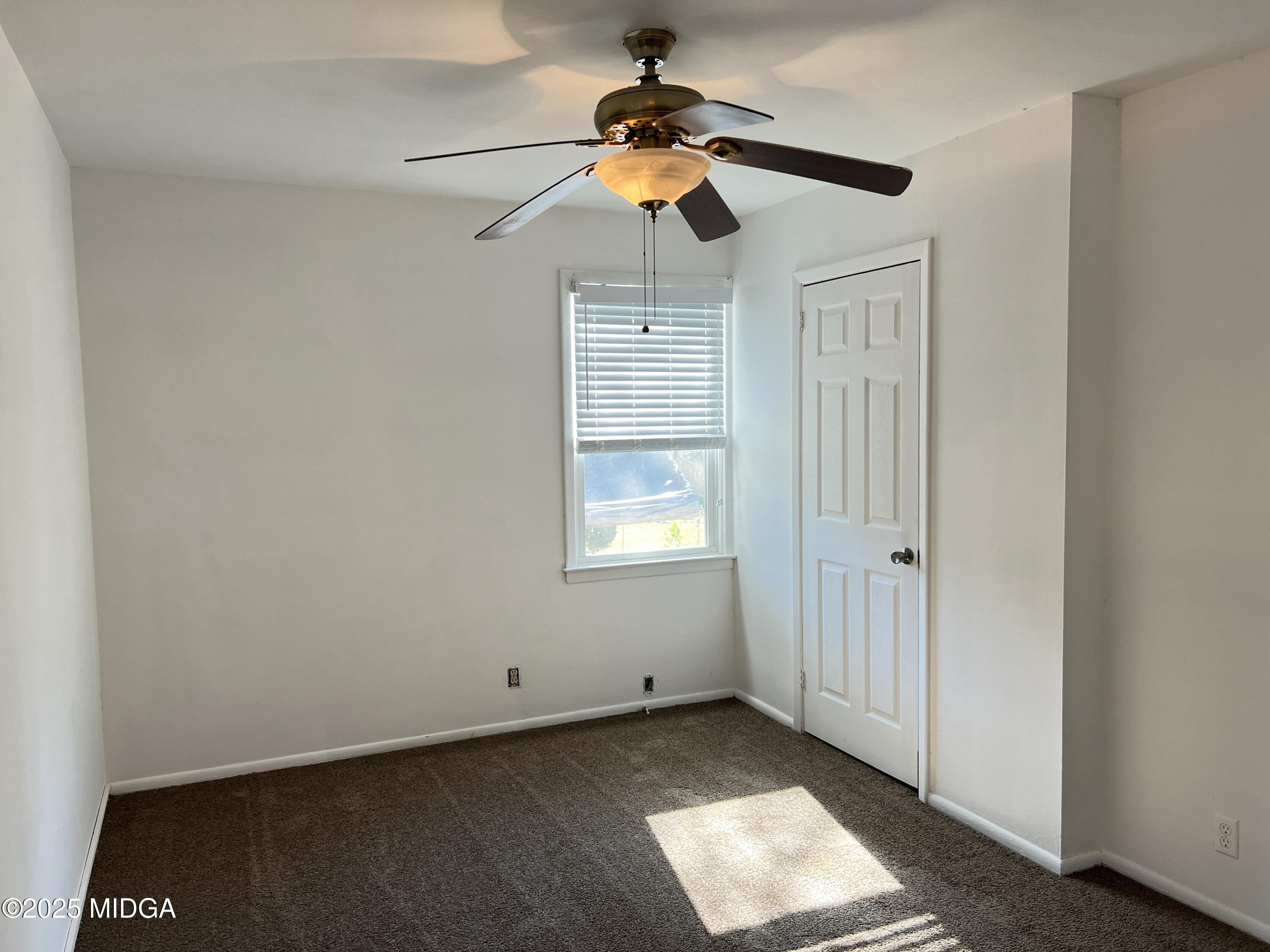 3347 Thunderbird Road Macon, GA 31217 - Photo 23 of 27 a very nice looking room with a window and a ceiling fan