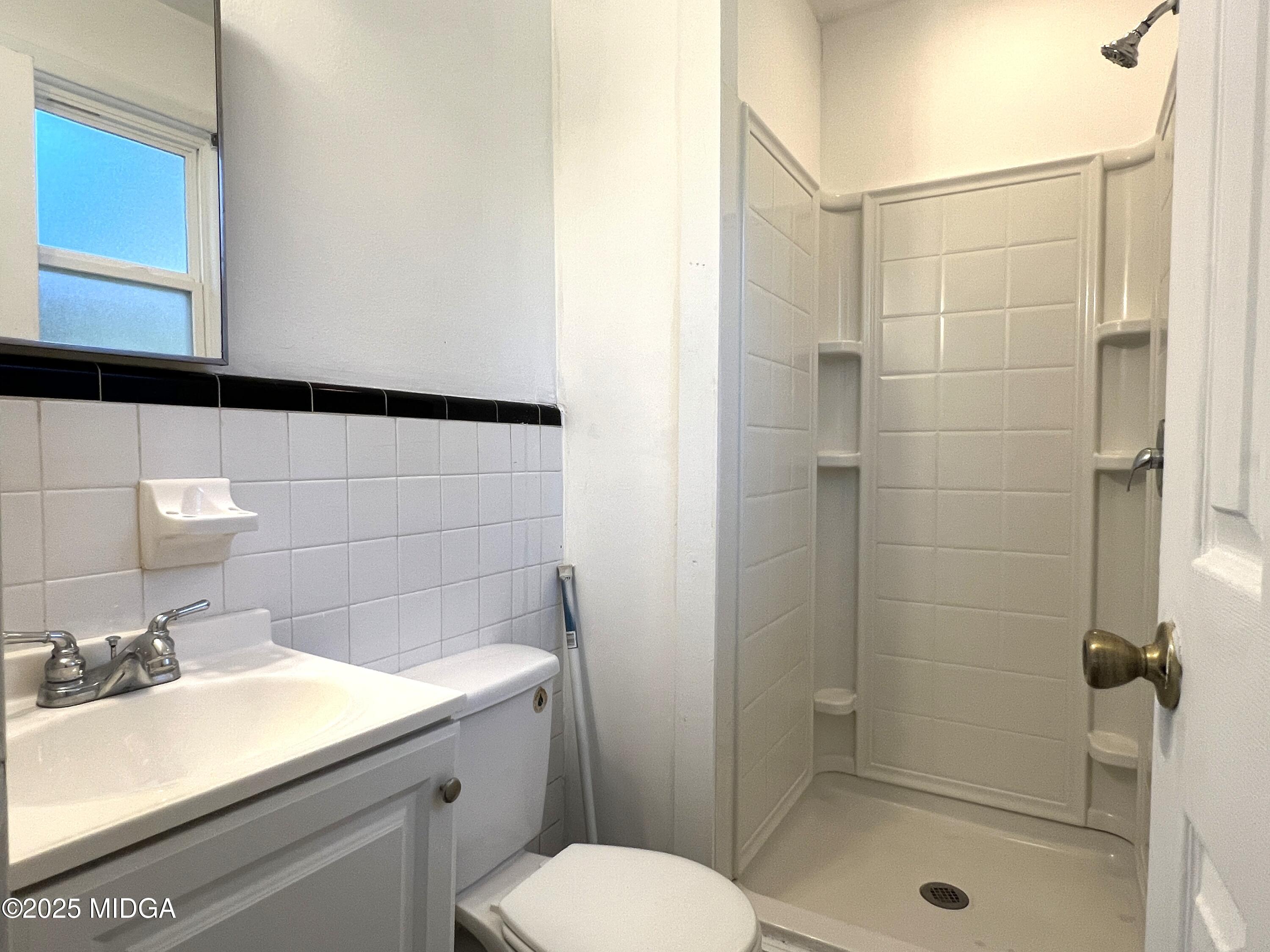 3347 Thunderbird Road Macon, GA 31217 - Photo 25 of 27 a bathroom with a sink toilet and shower