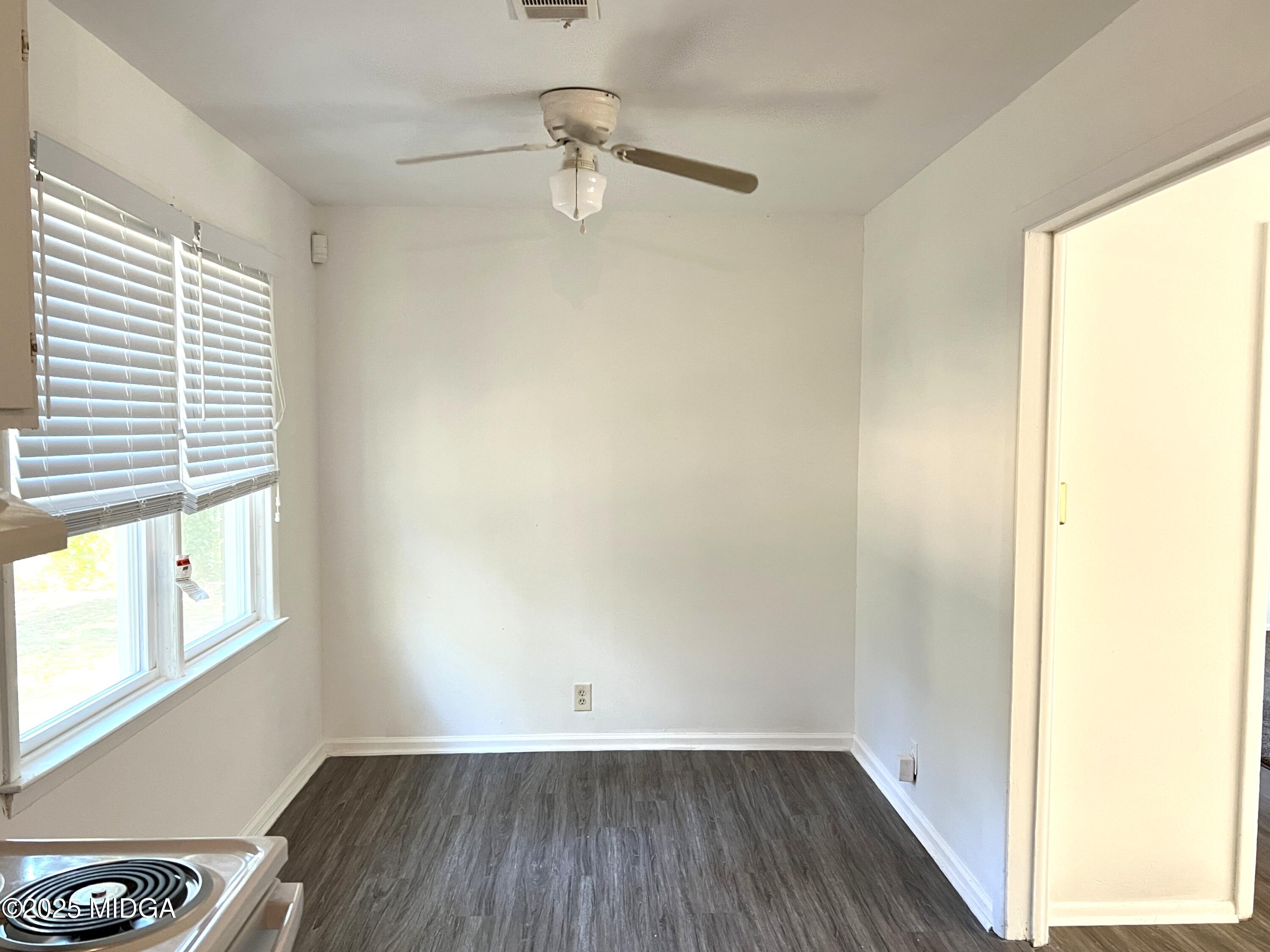 3347 Thunderbird Road Macon, GA 31217 - Photo 8 of 27 a view of a room with wooden floor and small window