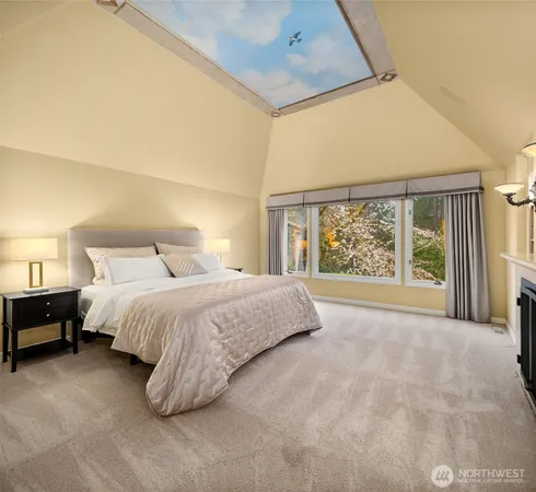 a bedroom with a large bed and a large window