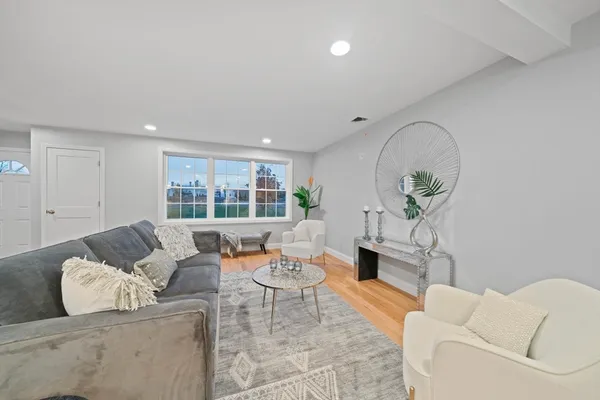a spacious bedroom with a bed and a couch