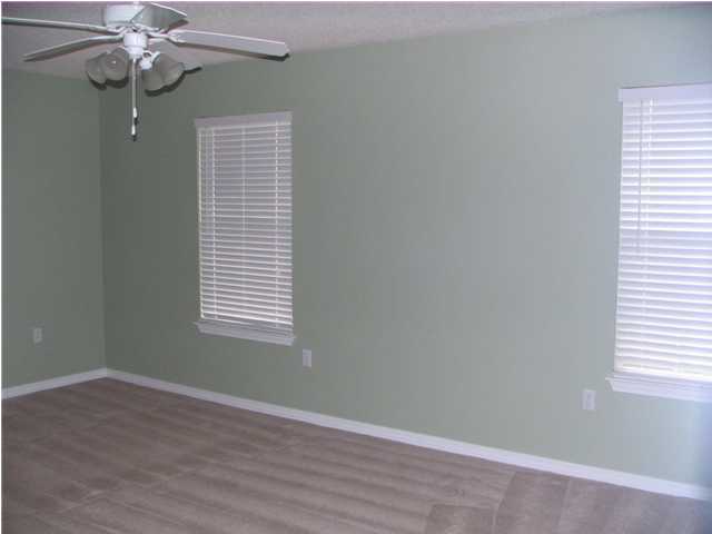 68 Inlet Drive Santa Rosa Beach, FL 32459 - Photo 10 of 10 an empty room with a window and wooden floor
