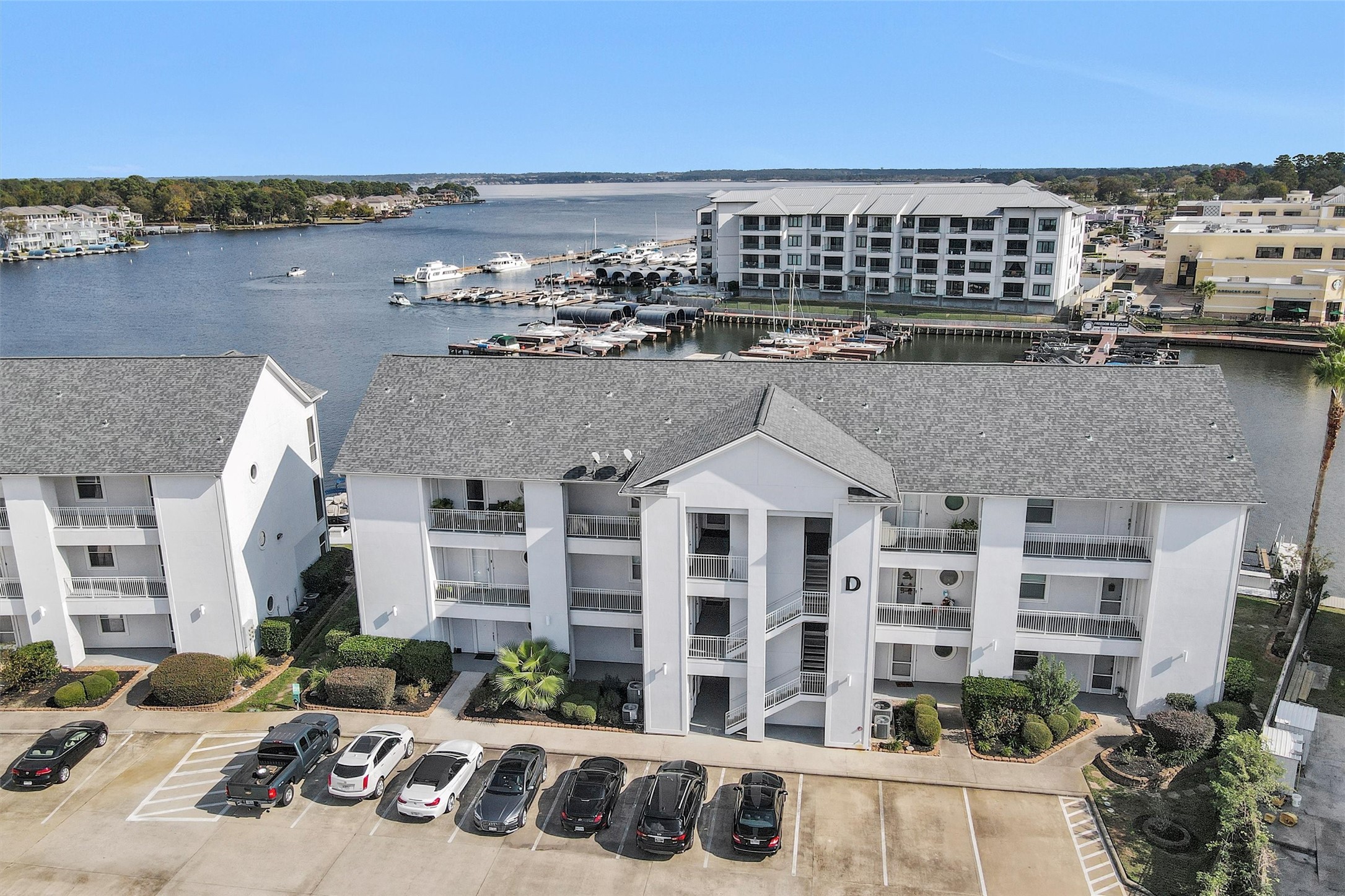 168 Lake Point Boulevard Montgomery, TX 77356 - Photo 24 of 34 a front view of a building with lake view and mountain view