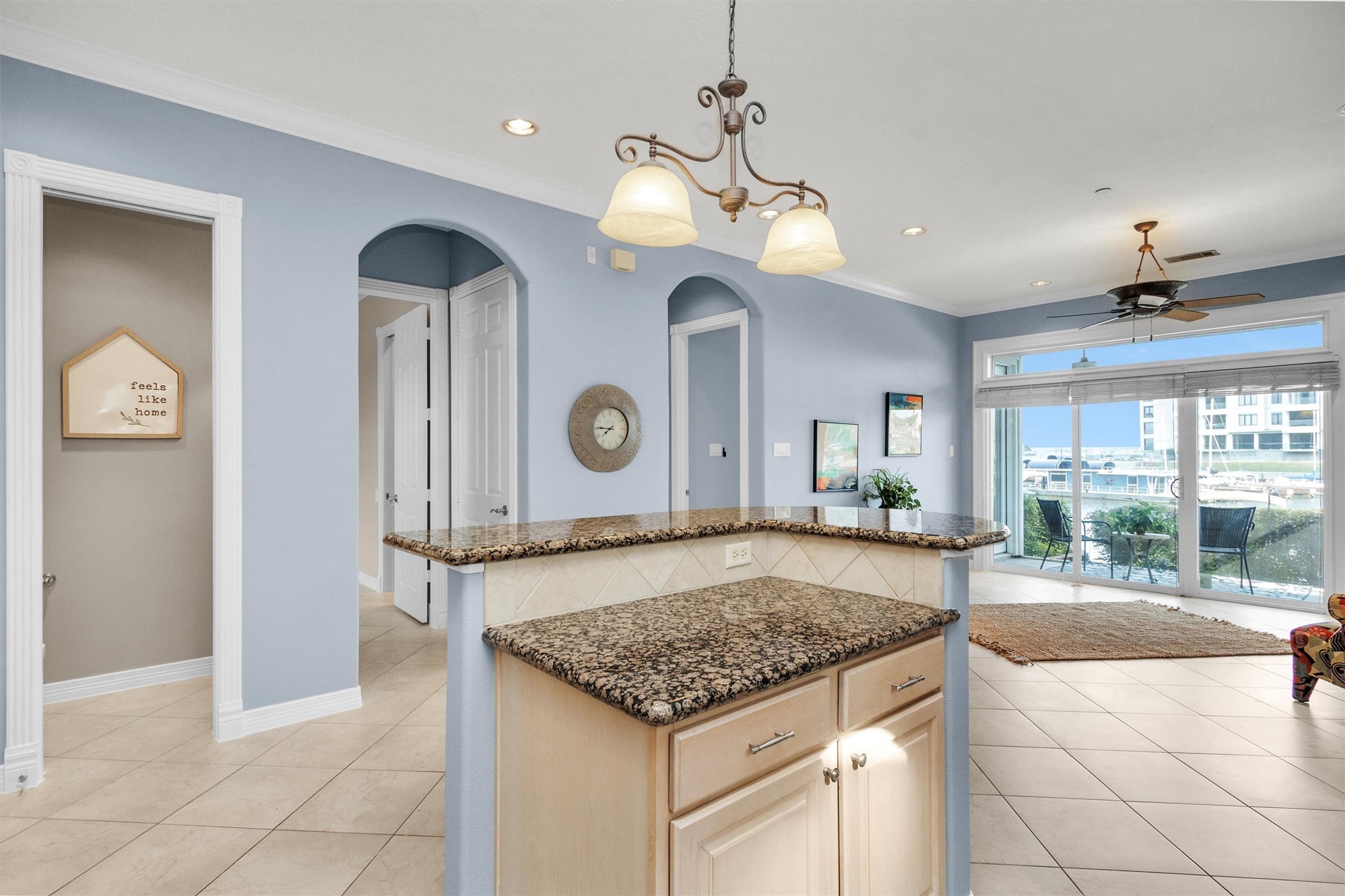 168 Lake Point Boulevard Montgomery, TX 77356 - Photo 9 of 34 a view of a kitchen with a stove and a chandelier