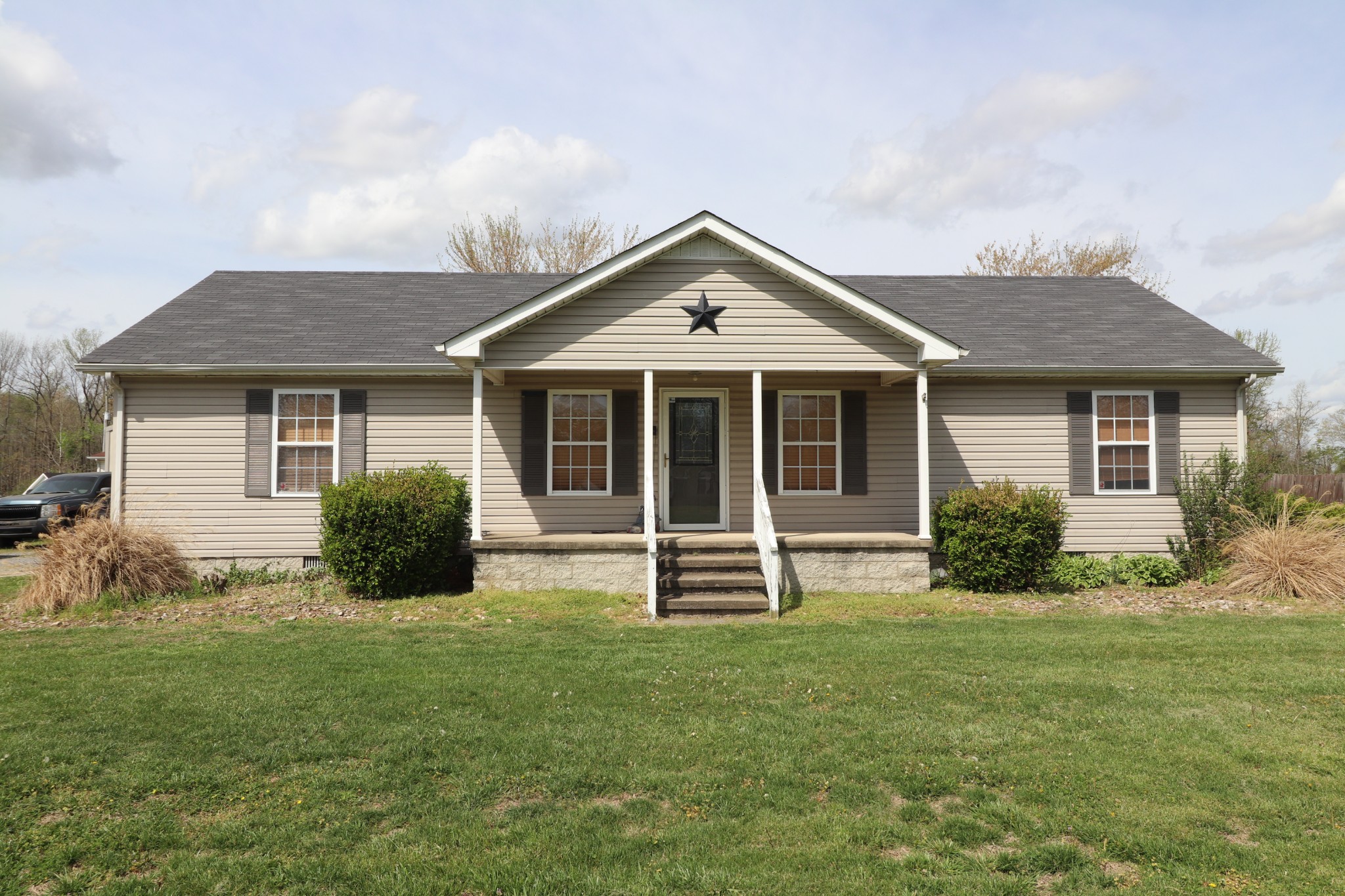 353 Stevens Circle Lafayette, TN 37083 - Photo 1 of 25 a front view of a house with a yard
