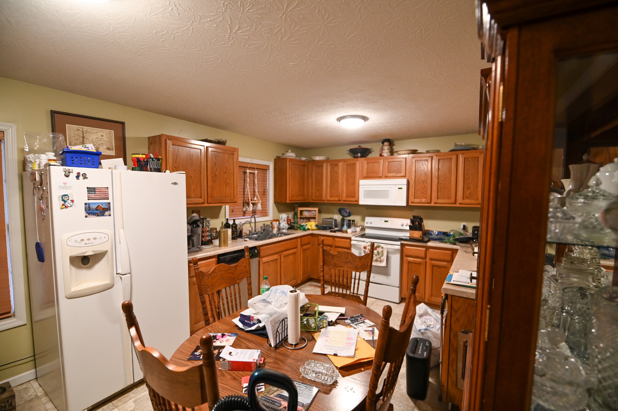 353 Stevens Circle Lafayette, TN 37083 - Photo 16 of 25 a kitchen with stainless steel appliances a refrigerator a sink a dining table and chairs