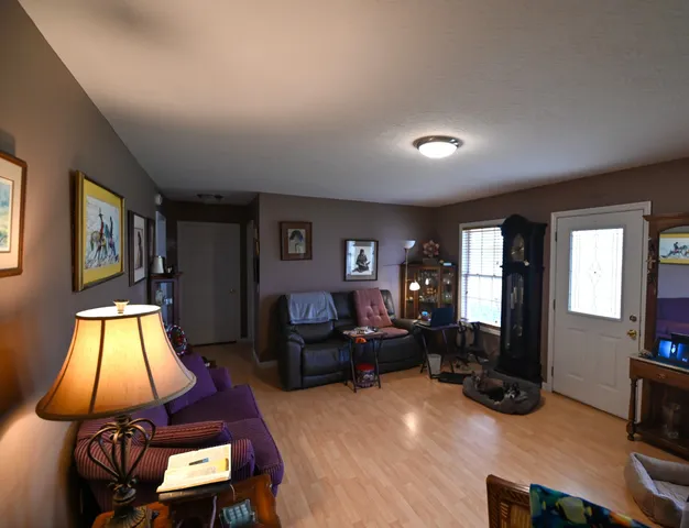 a living room with furniture fireplace and flat screen tv