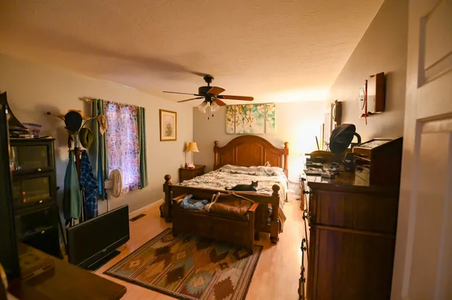 a kitchen with stainless steel appliances granite countertop a refrigerator stove and sink