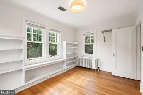 a view of balcony with wooden floor and outdoor seating