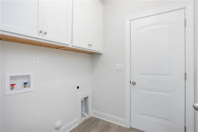 a view of storage and utility room with racks on the wall