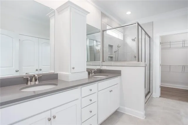 a bathroom with a granite countertop sink mirror and double