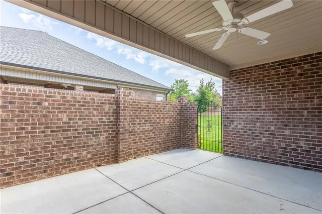 a view of outdoor space with brick wall