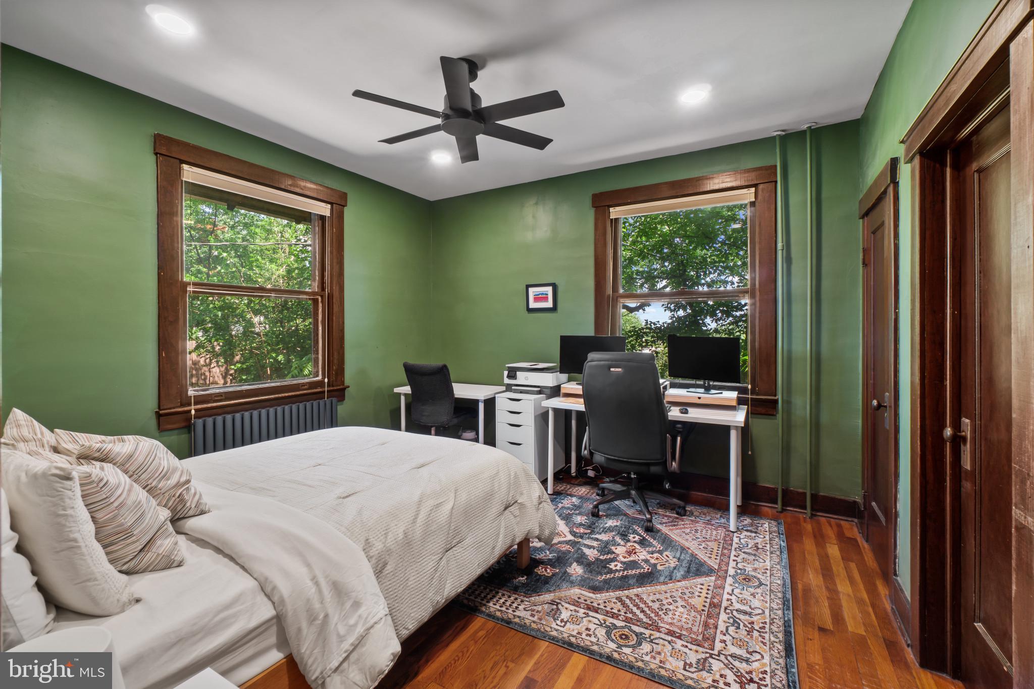 2900 Rueckert Avenue Baltimore, MD 21214 - Photo 18 of 40 a bedroom with a bed a large window with table and chairs