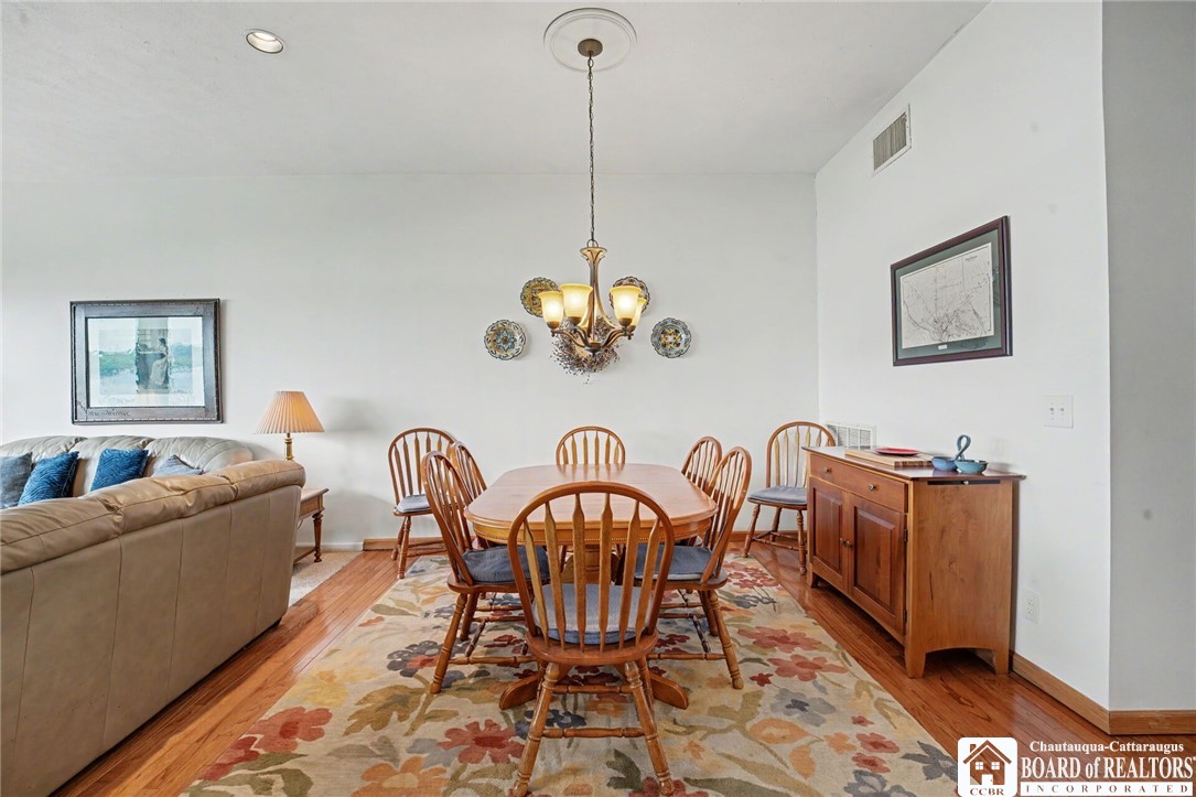 4568 Warners Bay Road Ellery, NY 14712 - Photo 12 of 43 Dining area with hardwood floors, Chandelier, and