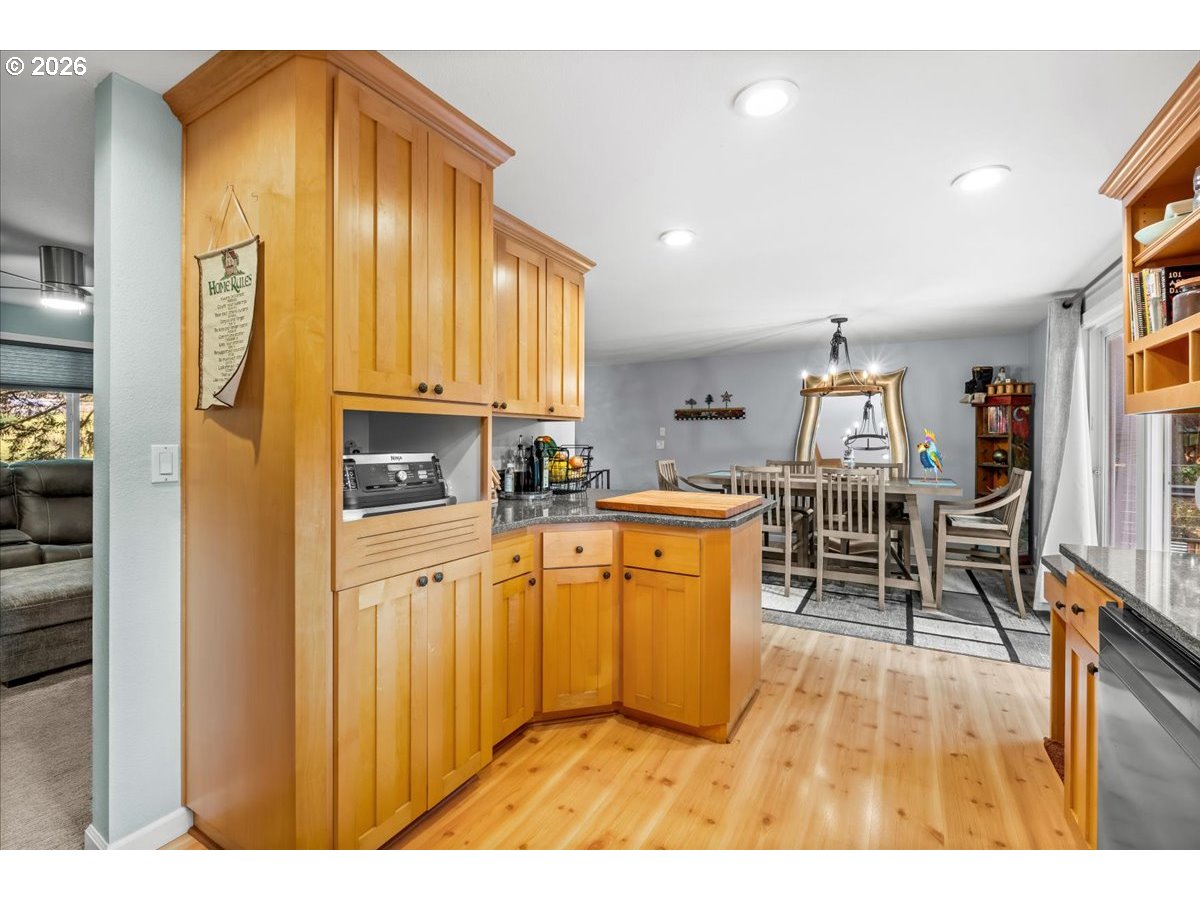 17110 South Potter Road Oregon City, OR 97045 - Photo 11 of 46 a open kitchen with stainless steel appliances granite countertop a granite counter tops and a view of living room