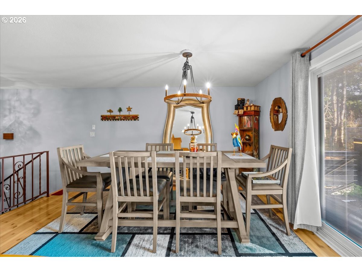 17110 South Potter Road Oregon City, OR 97045 - Photo 13 of 46 a view of a dining room with furniture window and wooden floor
