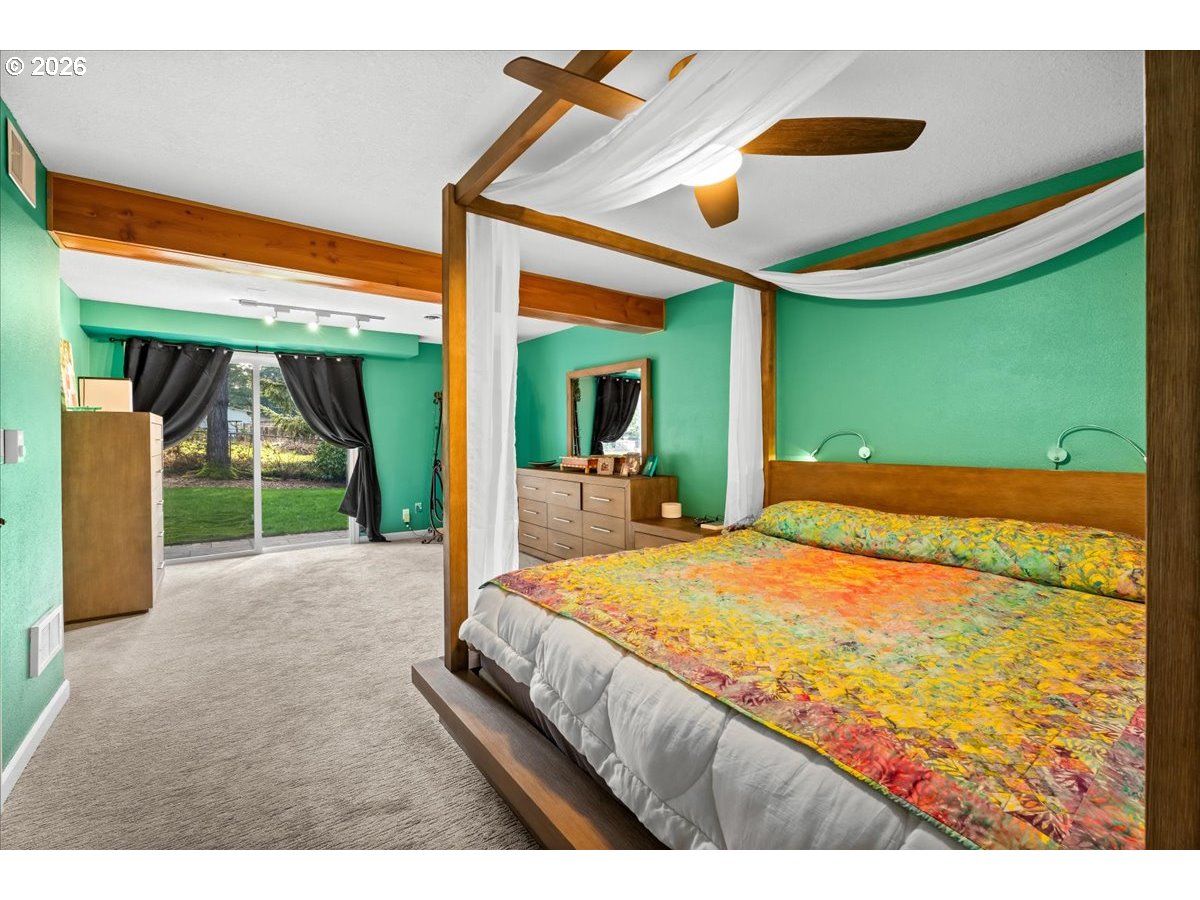 17110 South Potter Road Oregon City, OR 97045 - Photo 21 of 46 a bedroom with a bed and a large window