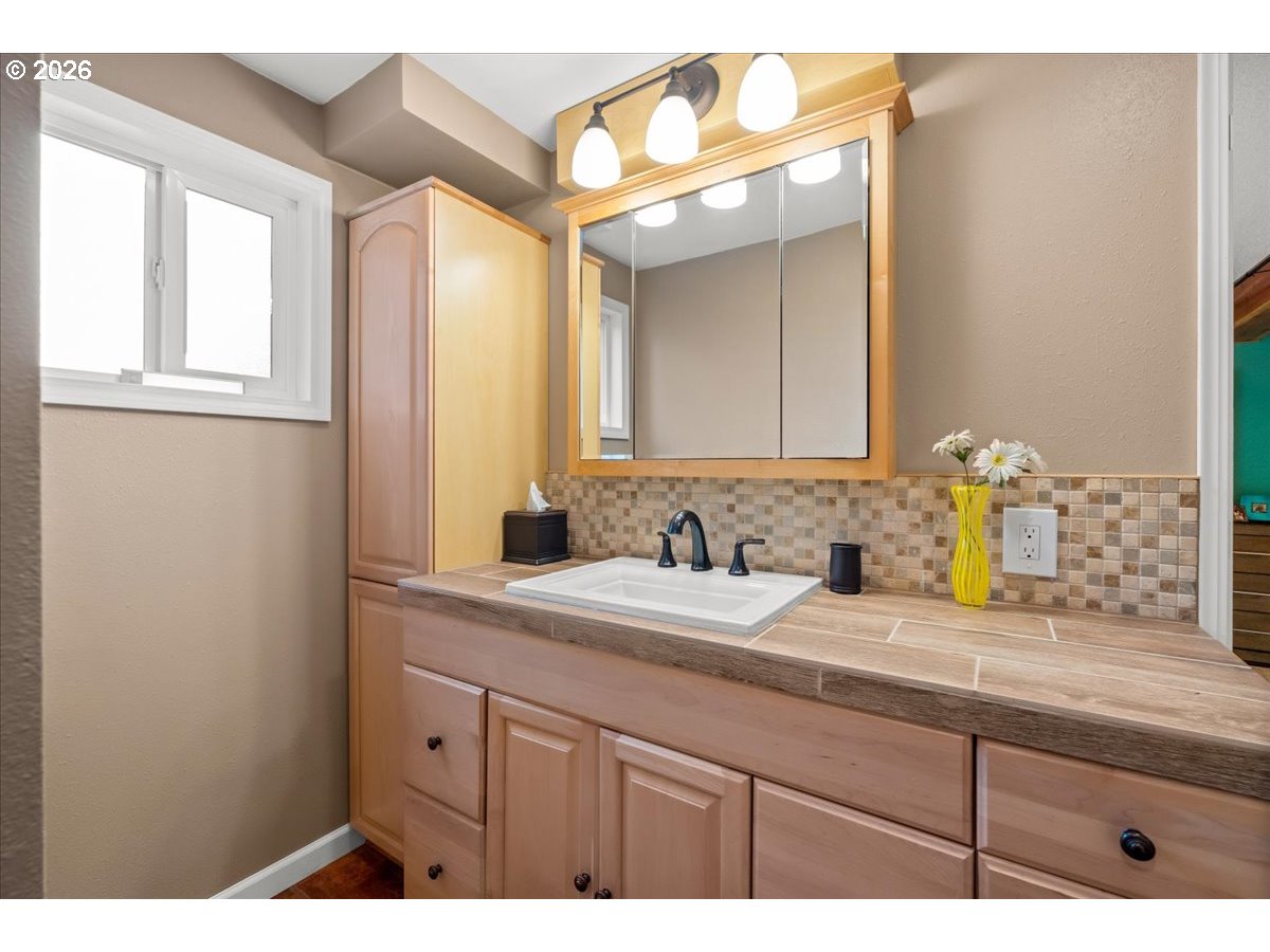 17110 South Potter Road Oregon City, OR 97045 - Photo 23 of 46 a bathroom with a sink and a mirror