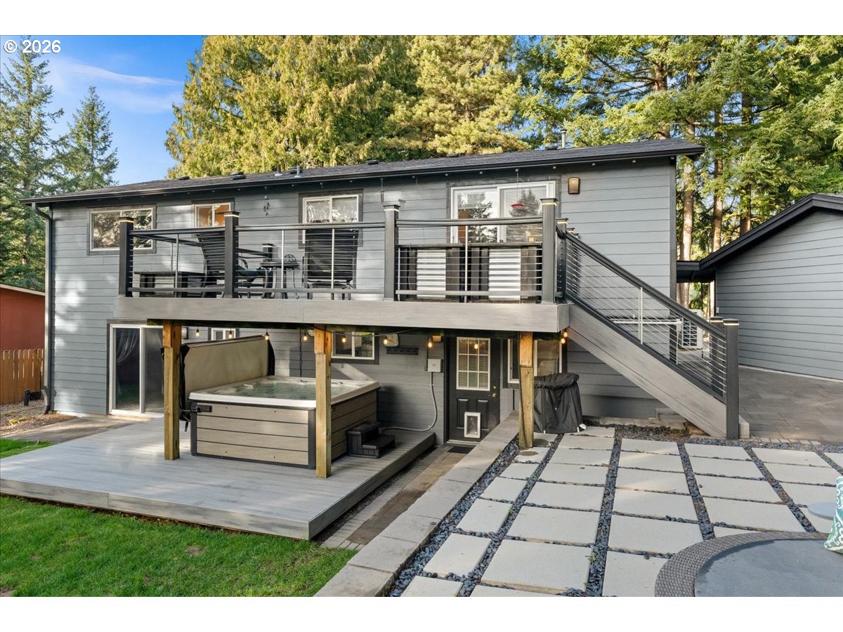 17110 South Potter Road Oregon City, OR 97045 - Photo 32 of 46 a view of backyard with large trees and a wooden fence