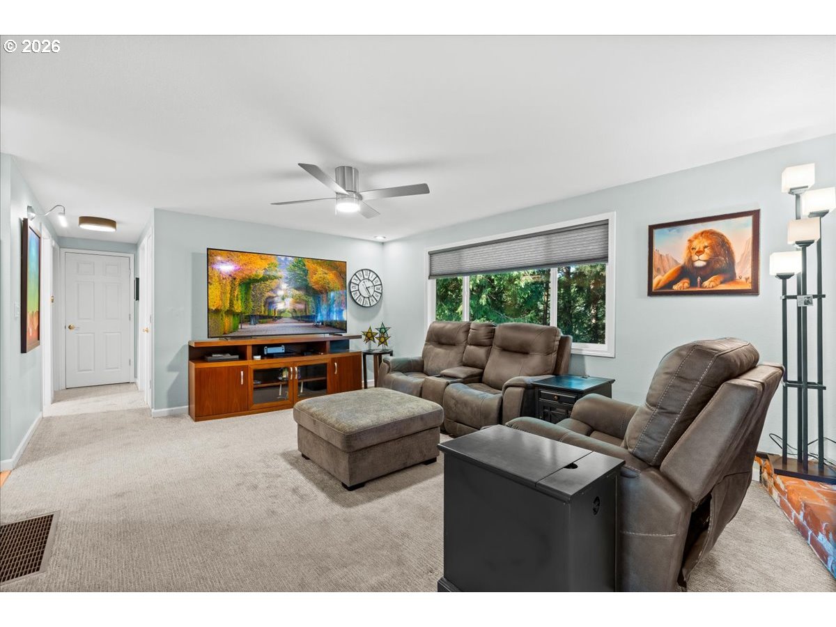 17110 South Potter Road Oregon City, OR 97045 - Photo 6 of 46 a living room with furniture and a flat screen tv