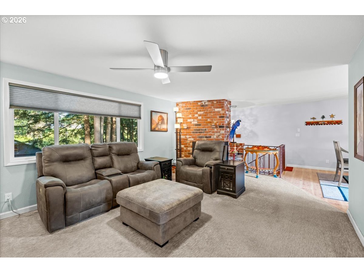 17110 South Potter Road Oregon City, OR 97045 - Photo 7 of 46 a living room with furniture and a flat screen tv