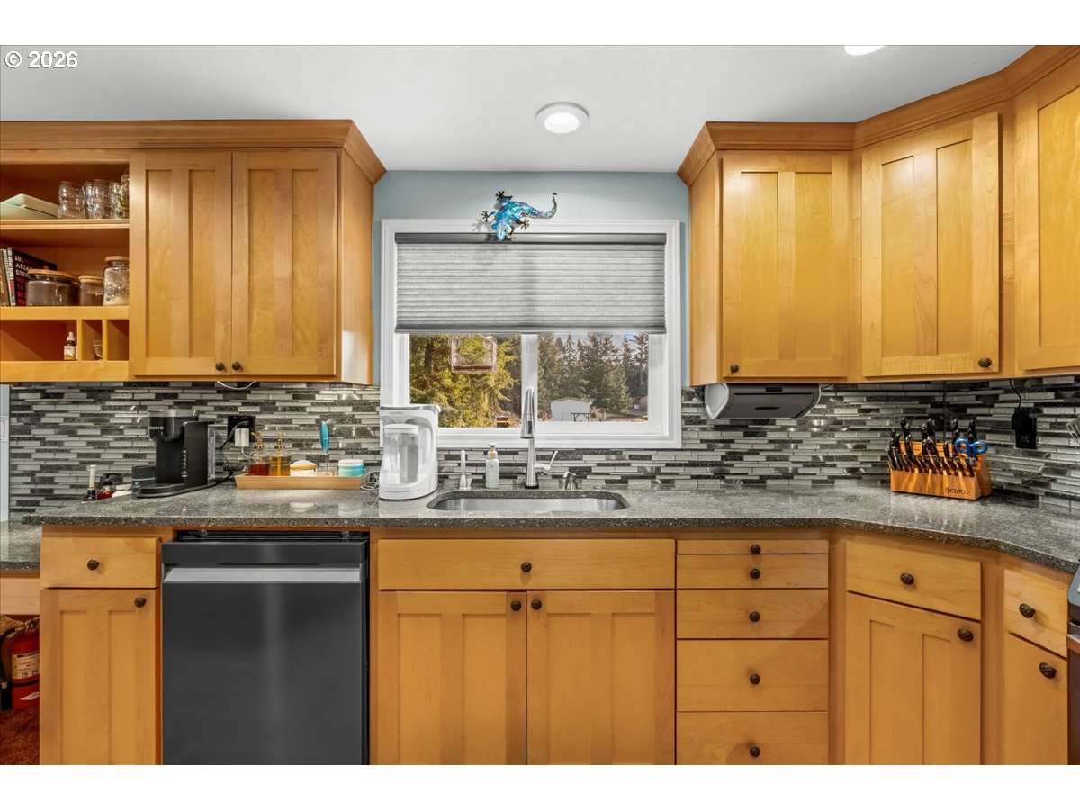 17110 South Potter Road Oregon City, OR 97045 - Photo 10 of 46 a kitchen with granite countertop a sink a window and cabinets