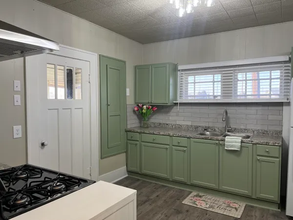 a kitchen with a sink and cabinets