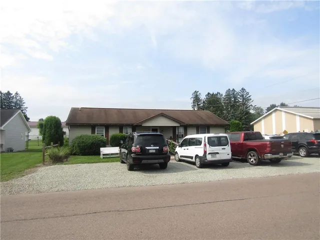 a car parked in front of a house